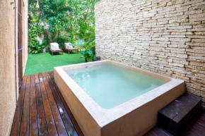 Apartamento con jardin en Aldea Zama -Luum- by Casago